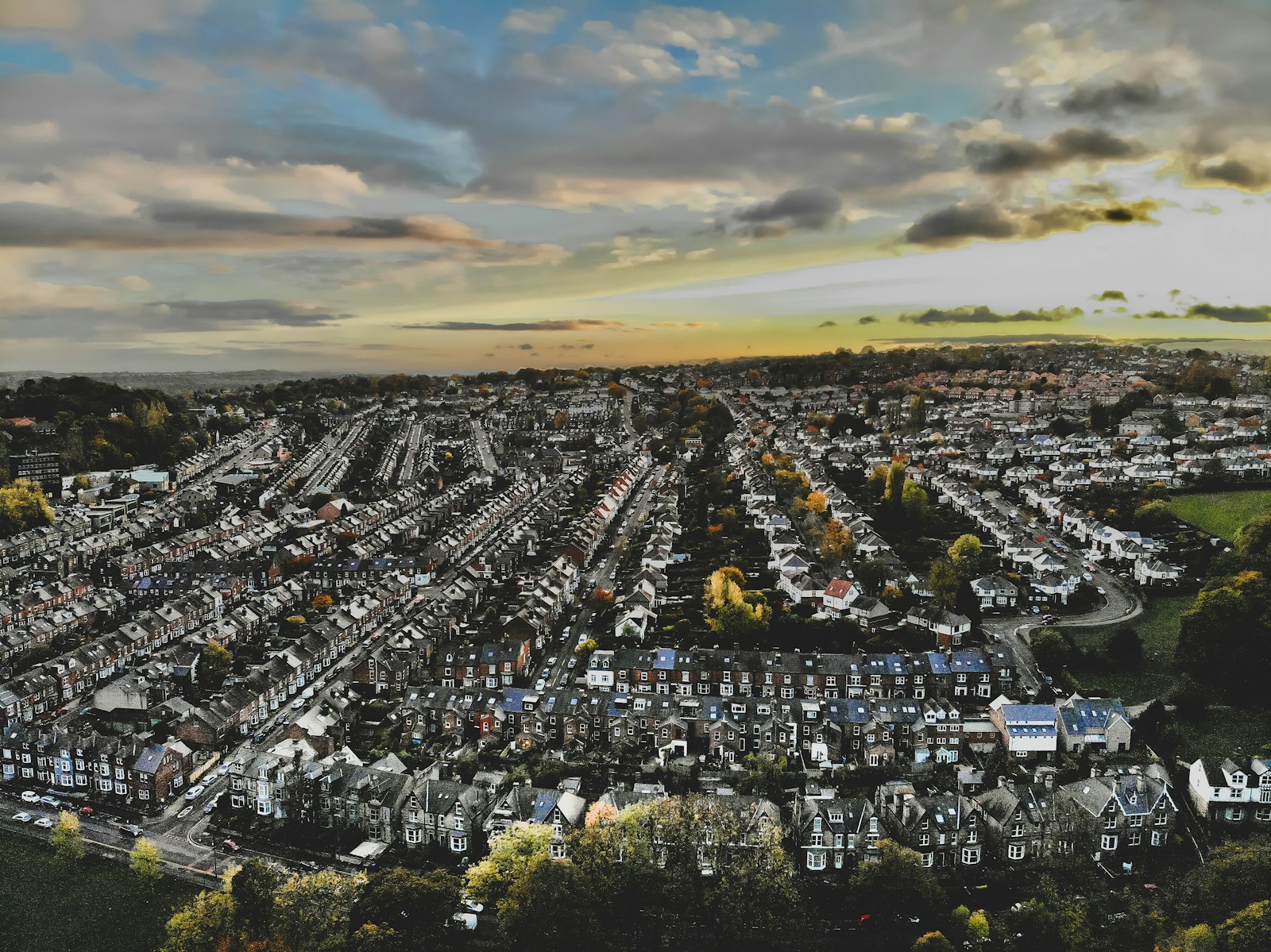 an aerial view of a city with lots of houses